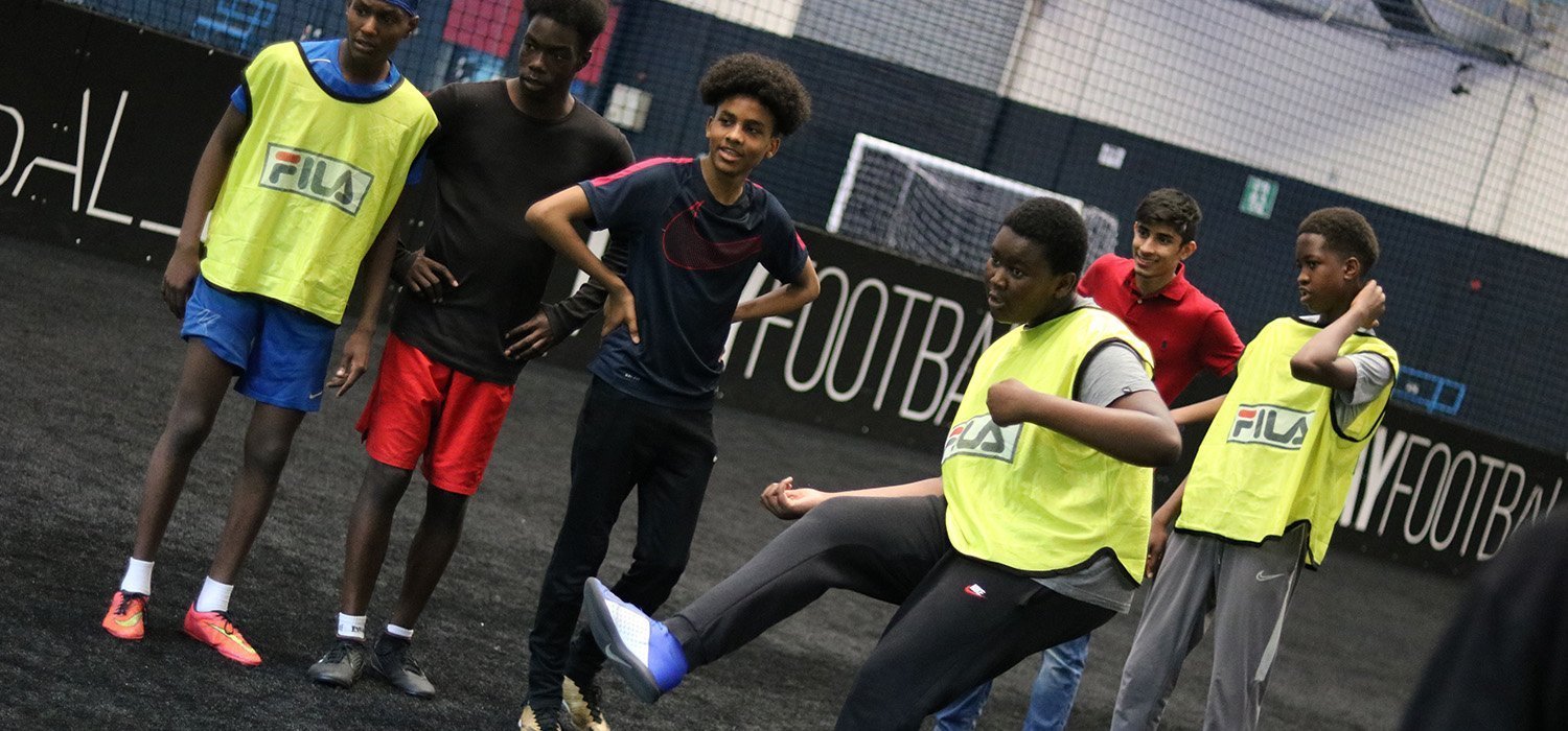 young people playing football